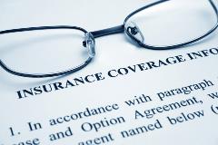 eyeglasses on insurance paper